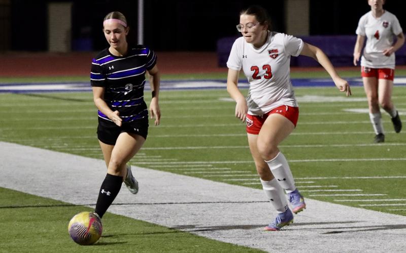 (THOMAS WALLNER | THE GRAHAM LEADER) Ava Street chases down a ball Friday, Feb. 13 against the Mineral Wells Lady Rams. The defense was stout once again for the Lady Blues in a 4-0 shutout.