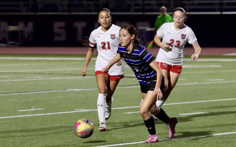 (THOMAS WALLNER | THE GRAHAM LEADER) Marisa Bueno runs after the ball Friday, Feb. 13 against the Mineral Wells Lady Rams. The offense for the Lady Blues put up an impressive four goals in a 4-0 win.