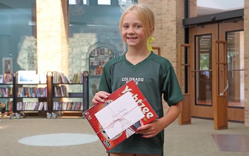 (ARCHIVE PHOTO | THE GRAHAM LEADER)  Participants in the Library of Graham Summer Reading Program picked up prizes from the library in July 2025. A number of prizes will be available during the program this year for juvenile, young adult and adult readers.