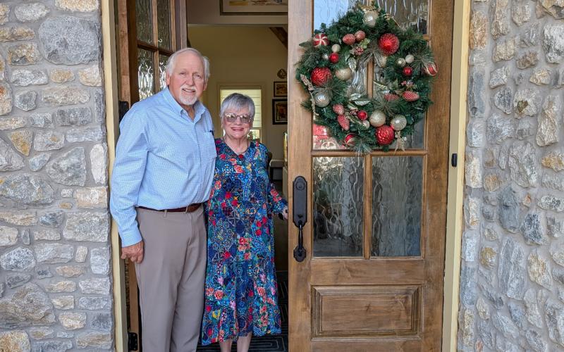 (WETA PHILLIPS | CONTRIBUTED PHOTO) Peggy and Reno Sonnenberg pose in front of their home at 2676 FM 3003 which is part of the Chautauqua Literary and Scientific Club Tour of Homes event. 