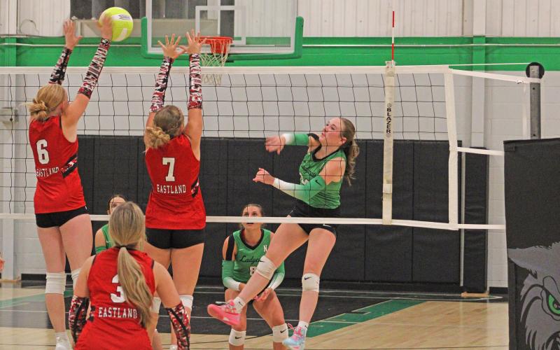 (ALEX HAVARDANSKY | THE GRAHAM LEADER) Sophie Terrell swats at the ball for a kill attempt in one of the Ladycats matches. Terrell has been a consistent offensive presence and had 15 kills in the Ladycats win over the Bryson Cowgirls Saturday, Oct. 4.
