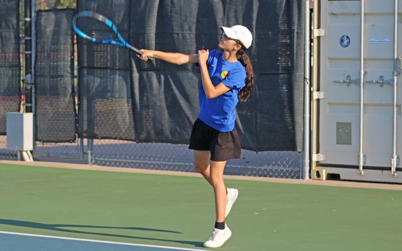 (ALEX HAVARDANSKY | THE GRAHAM LEADER) Stacey Gonzalez goes after a ball in a singles match. Gonzalez has been one of the most consistent competitors for the Lady Blues tennis team so far.