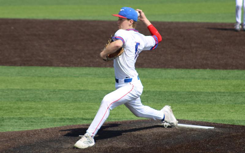 (ALEX HAVARDANSKY | THE GRAHAM LEADER) Ayden McDougal throws a pitch during the Steers hometown tournament Friday, March 6. The Steers pitching was locked in all tournament. 