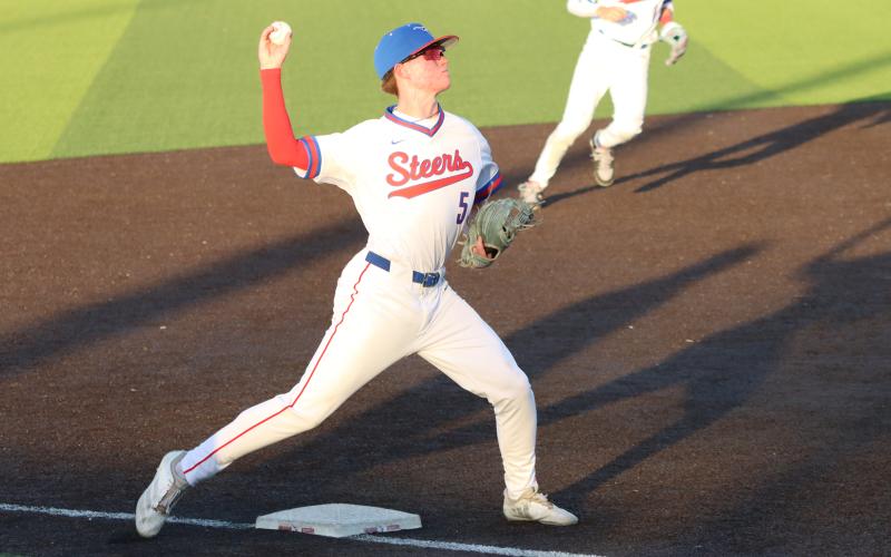 (THOMAS WALLNER | THE GRAHAM LEADER) Steers third baseman Colt Taylor makes a throw to first base Tuesday, March 24, against Brock. The Steers fell 10-0 in their district opener to the Eagles and looked to improve with a rematch against the Eagles on their home field Friday, March 24.