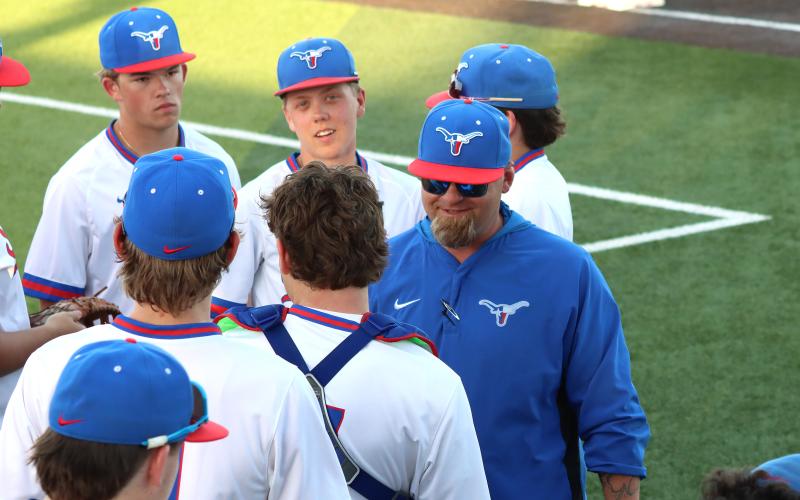 (THOMAS WALLNER | THE GRAHAM LEADER) Steers head coach Allen McGee speaks to his team during the Steers’ first matchup against the Brock Eagles held at home Tuesday, March 24. The Steers took on the team again Friday, March 27 and fell in five innings.