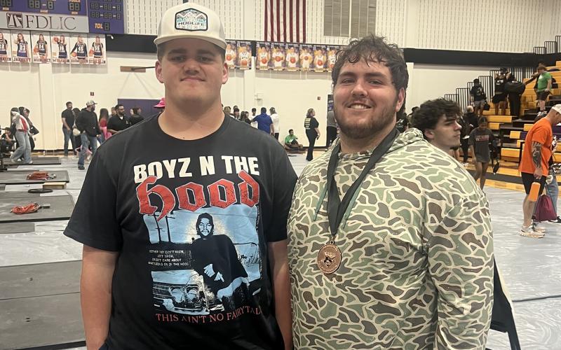 (GHS ATHLETICS | CONTRIBUTED PHOTO) McCrae Reese and Brennen Strawbridge at the regional powerlifting meet Saturday, March 14 in Abilene. Reese competed in the state competition Friday, March 27 and came away with a 10th-place finish in the 308-pound weight class.
