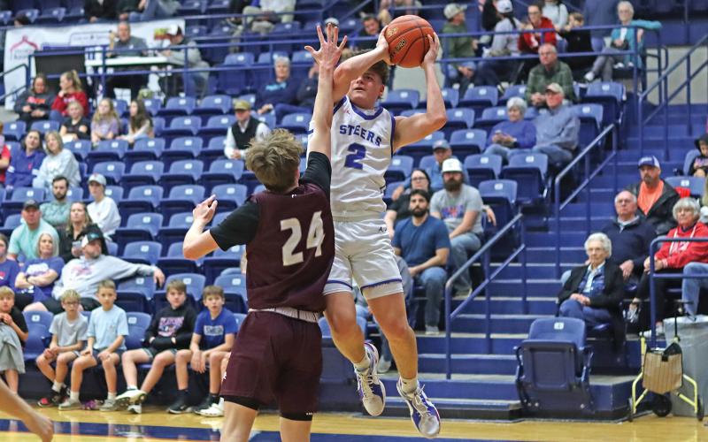 (ARCHIVE PHOTO | THE GRAHAM LEADER) Bryce Martin of the Steers jumps over a Brownwood defender to make a shot near the net during the game Friday, Jan. 31. 