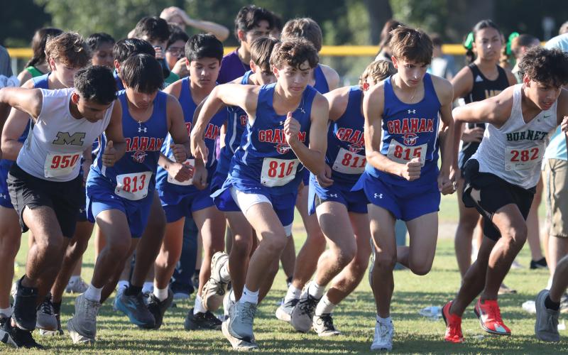 (KYLIE BAILEY | THE GRAHAM LEADER) The Graham Steers take off at the starting line for one of their cross country meets. The Steers and Lady Blues competed in the District 6-4A championships Monday, Oct. 6.