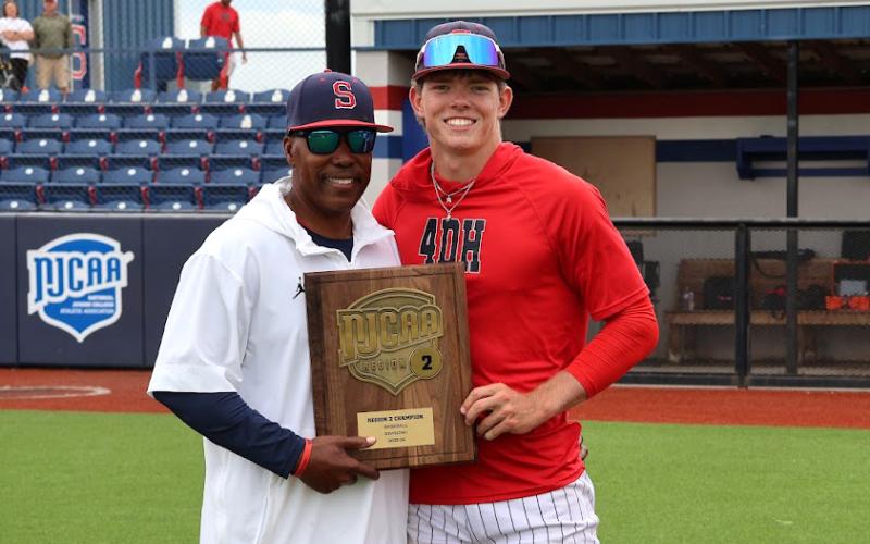 (LINSEY TAYLOR | CONTRIBUTED PHOTO) Former Graham Steer Ryder Taylor poses with his head coach Mack Chambers at Seminole State College after securing a spot in the NJCAA Division I JUCO World Series.