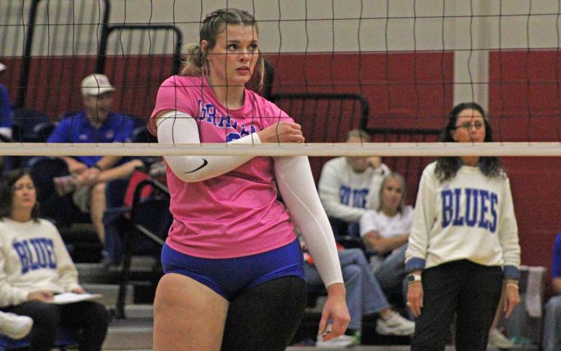 (ALEX HAVARDANKSY | THE GRAHAM LEADER) Senior Treyton McCullough fixes her arm sleeve as the team prepares to defend against the Brock Lady Eagles in their match Tuesday, Oct. 21. McCullough provides a solid defensive presence in the front row for the Lady Blues as well as being a veteran presence. 
