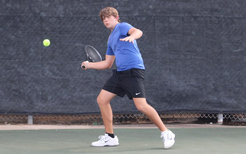 (ALEX HAVARDANKSY | THE GRAHAM LEADER) Tyler Bryan prepares to swing at a ball during one of his singles matches. Bryan has been a consistent power hitter for the Steers this season and won his singles match Tuesday, Sept. 30, against Holliday. 