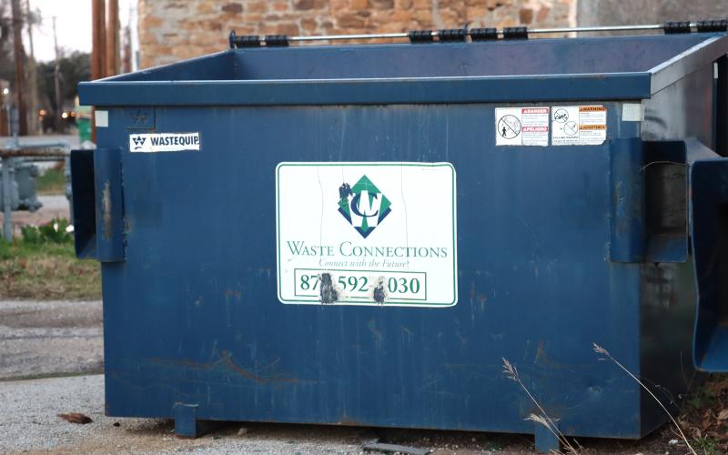 (THOMAS WALLNER | THE GRAHAM LEADER) A Waste Connections dumpster which will be exchanged for a dumpster of the same size from KC Dumpsters, the new garbage provider for the city of Graham. Dumpsters will be delivered to existing city customers during the week of Monday, Aug. 18 through Sunday, Aug. 31. 