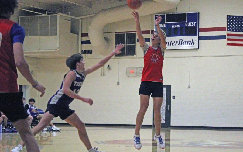 (ALEX HAVARDANSKY | THE GRAHAM LEADER) Jagger Nees attempts a three pointer during one of the Steers fall league matchups. Nees had the second most points in the Steers scrimmage matchups Saturday, Nov. 8, with 11 points on the day.