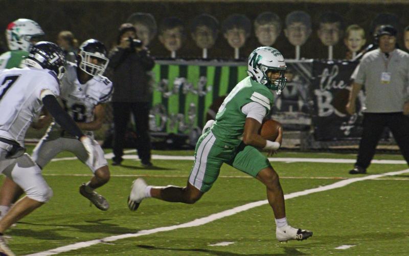 (ALEX HAVARDANKSY | THE GRAHAM LEADER) London Martinez runs up the middle of the field Friday, Nov. 21 in the Bobcats’ area round playoff game. Martinez was named district offensive most valuable player as well as being recognized as a first team all district defensive lineman and punter while earning a district all star selection.