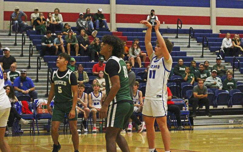 (ALEX HAVARDANKSY | THE GRAHAM LEADER) Cooper Wilde shoots a free throw from the charity stripe in one of the Steers’ previous matchups. Wilde scored eight points alongside Tyler Allen in the Steers’ 78-22 win Tuesday, Dec. 2 over the Colorado City Wolves.