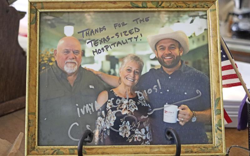 (TC GORDON | THE GRAHAM LEADER) Marlene’s at The Big Chill was featured on the TV show The Daytripper as one of the top food spots in Graham. Shown is a photo of Marlene and her husband Ben with the host of the show, Chet Garner.