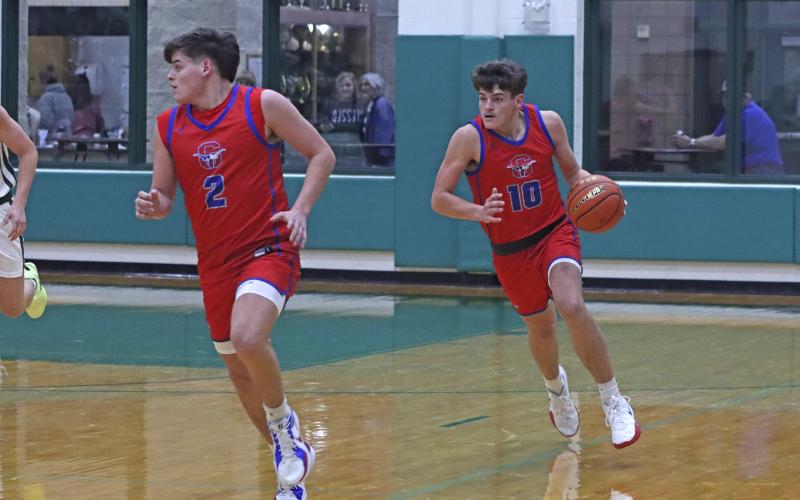 (TC GORDON | THE GRAHAM LEADER) Twin brothers Bryce Martin (2) and Brodie Martin (10) run up the court after getting a defensive stop Monday, Nov. 25 when Graham faced Breckenridge in a 49-45 Steers loss.