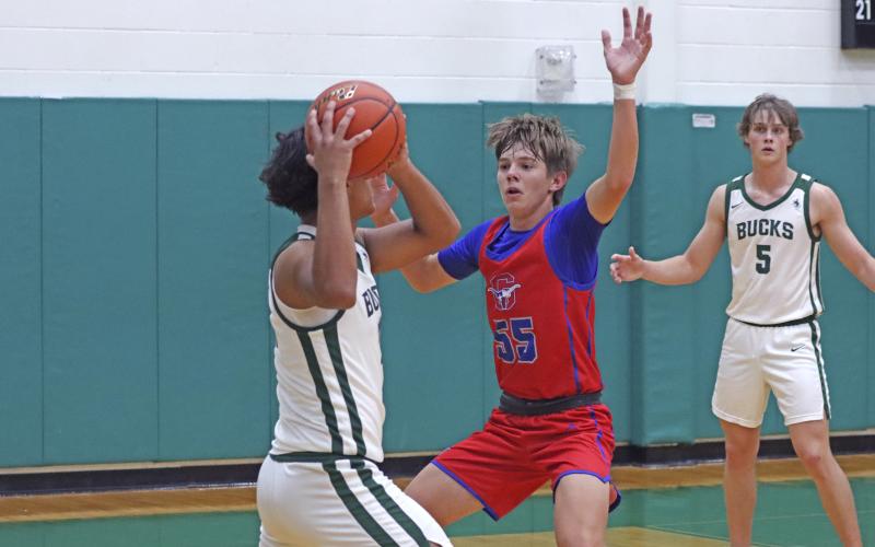 (TC GORDON | THE GRAHAM LEADER) Graham’s Jagger Nees keeps his hands up and the Breckenridge player in front of him while on defense during the Steers’ 49-45 loss to the Buckaroos this past Monday, Nov. 25.