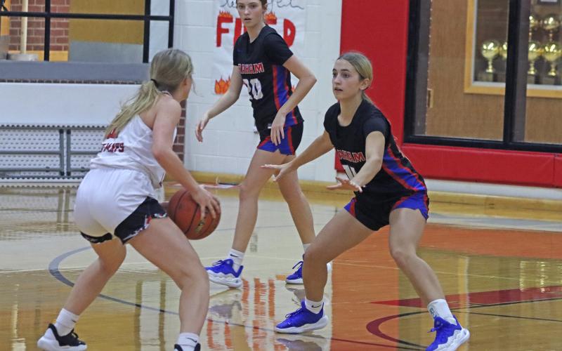 (TC GORDON | THE GRAHAM LEADER) The Lady Blues’ Ava Street (11) keeps her eye on the player in front of her while on defense Tuesday, Dec. 3 in Graham’s 60-52 win against Eastland.