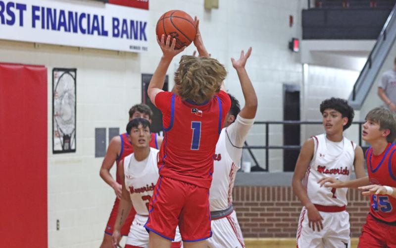 (TC GORDON | THE GRAHAM LEADER) Graham’s Tyler Allen shoots a close range shot over an Eastland defender Tuesday, Dec. 3 in the Steers’ 67-51 win over the Mavericks.
