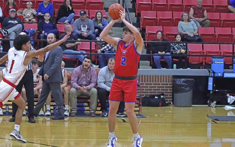 (TC GORDON | THE GRAHAM LEADER) Bryce Martin sets himself up and releases a 3-point attempt during the first half of Graham’s 67-51 win Tuesday, Dec. 3 against Eastland.