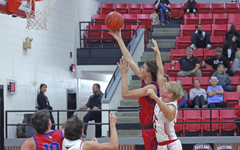 (TC GORDON | THE GRAHAM LEADER) Nikolas Wankowicz reaches and extends for a shot while getting fouled in the lane Tuesday, Dec. 3 in Graham’s 67-51 win over Eastland.