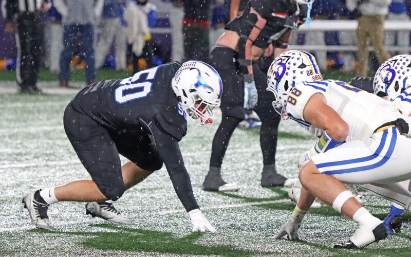 (TC GORDON | THE GRAHAM LEADER) The Steers’ Blake Bergeson lines up on the edge of the defensive line against an Eagle offensive lineman Friday, Dec. 6 in Graham’s 12-10 region final loss to Brock.