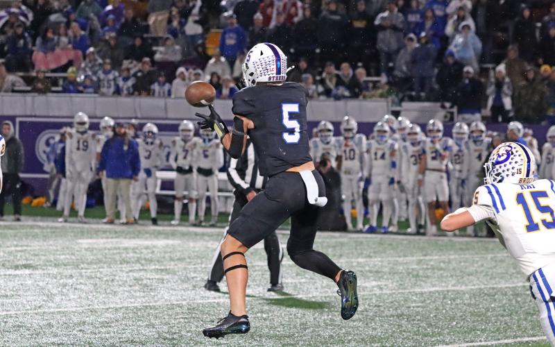 (TC GORDON | THE GRAHAM LEADER) Receiver Harison Brockway jumps into the air to catch a pass for an important gain during part of Graham’s region final game Friday, Dec. 6, a 12-10 triple overtime loss to Brock.