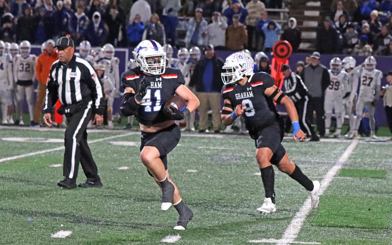 (TC GORDON | THE GRAHAM LEADER) Linebacker Jayton Hearne (41) checks over his shoulder as he begins to return an interception he caught while teammate Mateo Rodriguez (9) looks for someone to block. The pick was one of three the Steers had in an eventual 12-10 triple overtime loss to the Brock Eagles in the region final.