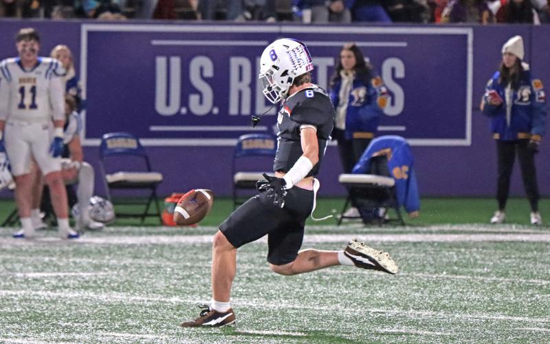 (TC GORDON | THE GRAHAM LEADER) Graham punter Jace Gill keeps his eye on the ball as he goes to kick it away late in the game Friday, Dec. 6 in the Steers’ 12-10 triple overtime loss in the region final to the Brock Eagles.