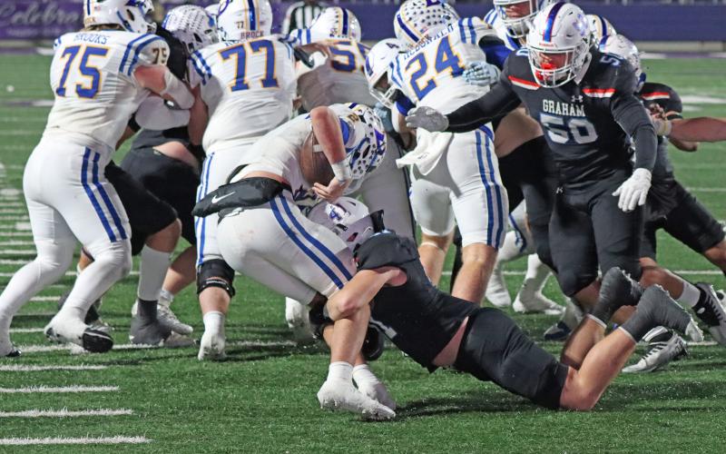 (TC GORDON | THE GRAHAM LEADER) Graham linebacker Jayton Hearne (41) sacks the opposing quarterback deep in Brock territory late in the game Friday, Dec. 6. The Steers and Eagles battled, but Brock won the game in triple overtime 12-10 to claim the region title.