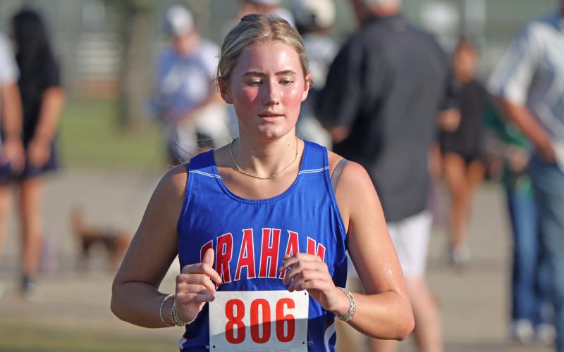 (KYLIE BAILEY | THE GRAHAM LEADER) Zoe Stovall makes her way around the running course at the Thrill of the Hill Invitational. Stovall finished 131 out of 161 runners at the event which took place Wednesday, Oct. 1. 