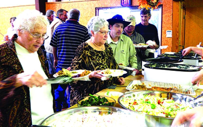 Bethel Baptist Church of Graham, 209 Tennessee St., will host itsfree  Thanksgiving Day dinner from noon to 1:30 p.m. Thursday, Nov. 24. As seen in this photo from a past dinner, volunteers spend part of their holiday serving the traditional fare to their fellow community members.  Contributed photo