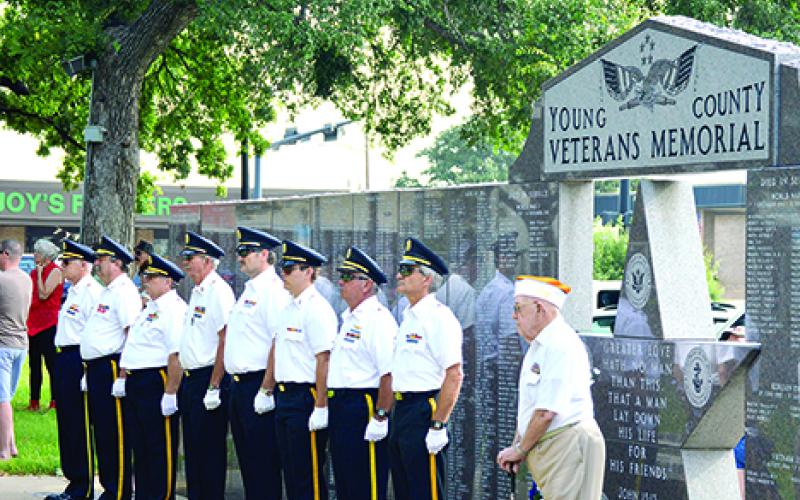 American Volunteer Reserve Members stand in front of the Young County Veterans Memorial and assist with the flag folding, wreath laying, missing man and Service Star flag presentations at the “Red White and You” event on the courthouse lawn July 4. On Oct 31 it was announced the The Young County Veterans Memorial mayget a new addition to honor Young County Veterans of the 21st century.  Leader file photo