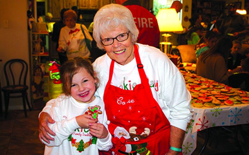 Graham resident Mary Braddock stands with her great-granddaughter, Kayleigh Sams, 8, at the annual Cookie Day celebration which Braddock held at her home on Westwood Drive last Friday afternoon. Leader photos by Samantha Isbell