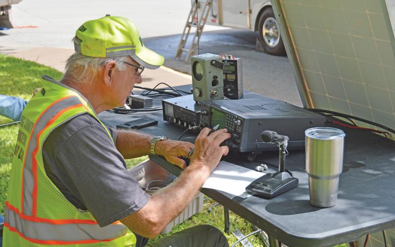 (FILE PHOTO | THE GRAHAM LEADER) Young County Amateur Radio Club President Dan Hooper adjusts a high frequency radio during the American Radio Relay League Field Day in 2020 on the Graham downtown square. The ARRL Field Day is hosted the fourth weekend of June each year and this year was hosted Saturday, June 25.
