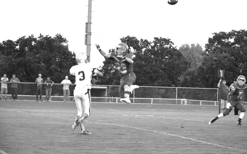 Bryson’s Tanner Buchanan tried to bat down a pass by the Notre Dame quarterback p.m. Friday, Sept. 9, in Moran. during the Cowboys’ 69-24 win Friday. (Leader photo by Monica Buchanan)