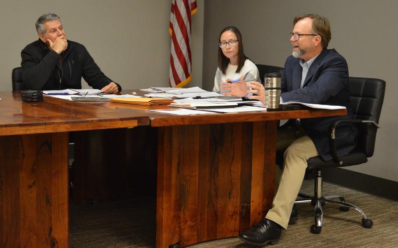 (THOMAS WALLNER | THE GRAHAM LEADER) City Manager Eric Garretty (at right) speaks to the Graham City Council during a regular council meeting Thursday, Dec. 22. Shown from left to right are City Councilman Randy Cantin, City Secretary and Finance Director Marci Bueno and Garretty. 