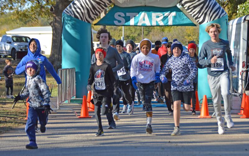(THOMAS WALLNER | THE GRAHAM LEADER) The Spivey Hill Challenge 5K, 1K Fun Run and Walk and Talk took off Saturday, Nov. 12 at Fireman’s Park in Graham. Shown are runners beginning the 5K run.