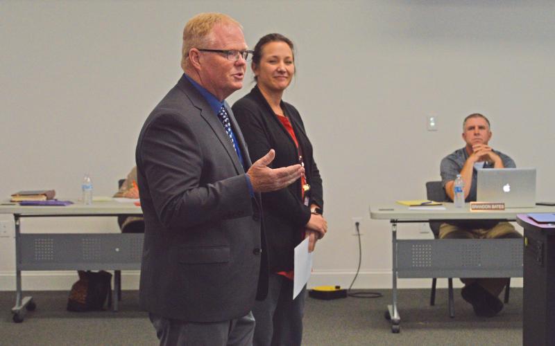 (THOMAS WALLNER | THE GRAHAM LEADER) Graham ISD Director of Curriculum and Instruction, Gary Browning, and Special Programs Director, Natalie Husen, speaking with the GISD Board of Trustees on Wednesday, Nov. 9. The two spoke on the Graham Incentive for Teachers program.