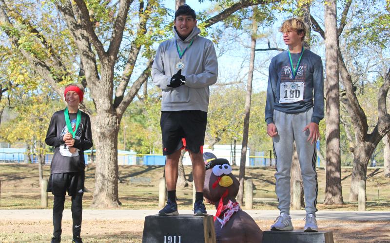 (KYLIE BAILEY | THE GRAHAM LEADER) Overall male winners in the Spivey Hill Challenge 5K race. The top three winners were Marcos Gonzalez, Andon Masterfield and Luke Finfrock.