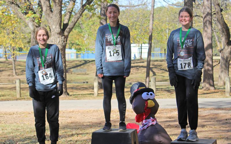 (KYLIE BAILEY | THE GRAHAM LEADER) Female 11 to 14 winners in the Spivey Hill Challenge 5K race. The top three winners were Marisa Bueno, Jensen Pettus and Ava Street.