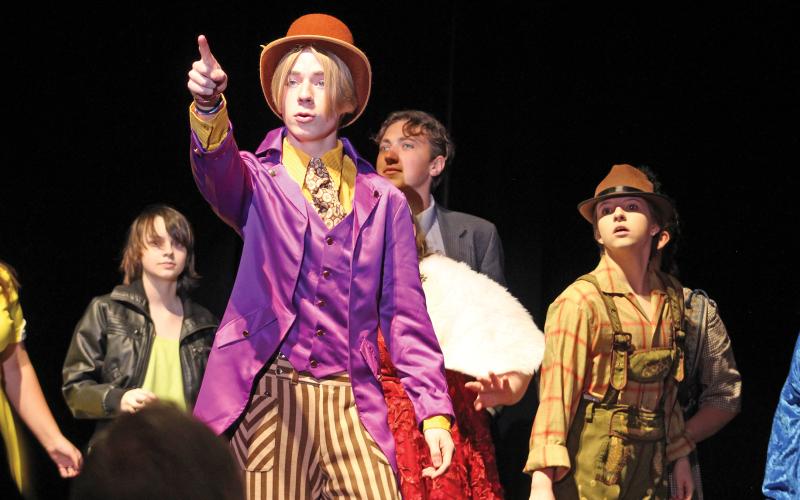 (KYLIE BAILEY | THE GRAHAM LEADER) Willy Wonka, played by Jack Page, shows golden ticket winners around his factory during the Graham Junior High School and Graham High School’s performance of Roald Dahl’s “Willy Wonka Jr.” on Sunday, Dec. 4.