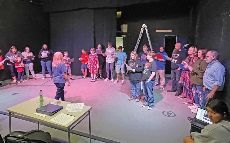 (CONTRIBUTED PHOTO | KATIE HUITT) Graham Regional Theatre actors in ‘A Christmas Carol’ rehearse the play at The Perry theater in Graham. The show will have four performances this week.