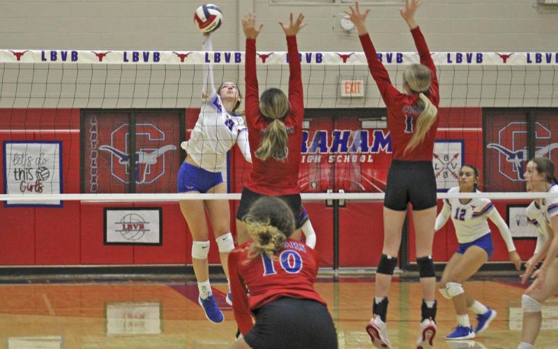 (MIKE WILLIAMS | THE GRAHAM LEADER) Lady Blues senior Trinity Gregory takes a swing during the first set of the Lady Blues’ 3-1 win over Abilene Cooper Tuesday at Graham High School. Gregory finished the senior night win with 11 kills and 10 blocks. Gregory was honored along with fellow seniors Abby Osborn, Tatum Westerman, Miya Cantwell and Bobbie Jo Hart.