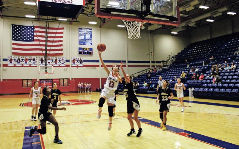 (MIKE WILLIAMS | THE GRAHAM LEADER) Tara Dawson shoots a layup during the first quarter of JV Red's 43-37 win Tuesday, Nov. 15 at Graham High School.