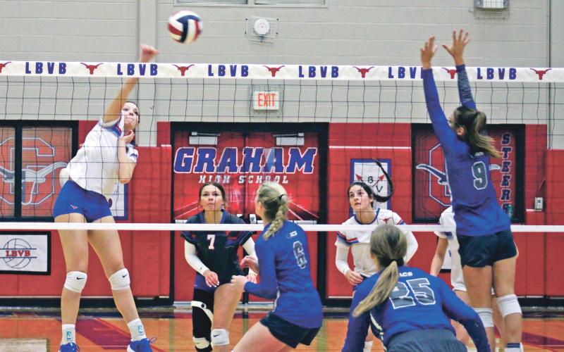 (MIKE WILLIAMS | THE GRAHAM LEADER) Lady Blues sophomore Lillian Noble earns a kill during the first set of the Lady Blues 25,21, 29-27, 25-13 win over Abilene Christian Tuesday, Sept. 13 at Graham High School. Noble finished the match with eight kills and four blocks.