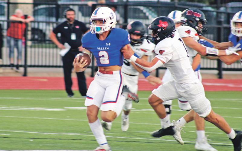 (MIKE WILLIAMS | THE GRAHAM LEADER) Rylan Monsey (2) along with Michael Young each ran for over 100 yards Friday, Sept. 23 in the Steers’ 59-14 win over Mineral Wells. Monsey finished the game with 12 carries for 150 yards and two rushing touchdowns. He also caught four passes for 44 yards and two touchdowns. Missing one game due to injury, Monsey has 65 carries in four games for 699 yards and five rushing touchdowns.