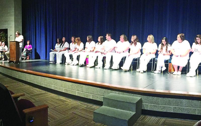 LVN graduates listen as Amanda Sallee, LVN graduate, welcomes friends, family, faculty and staff to the pinning ceremony Aug. 9. (Photos courtesy of NCTC)