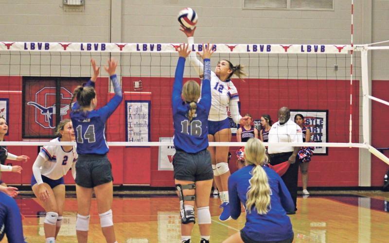 (MIKE WILLIAMS | THE GRAHAM LEADER) Lady Blues senior Olga Morales swings at the ball during the third set of the Lady Blues’ sweep of Abilene Christian Tuesday evening at Graham High School. Morales led the Lady Blues with 12 kills, six blocks, two aces and three assists.
